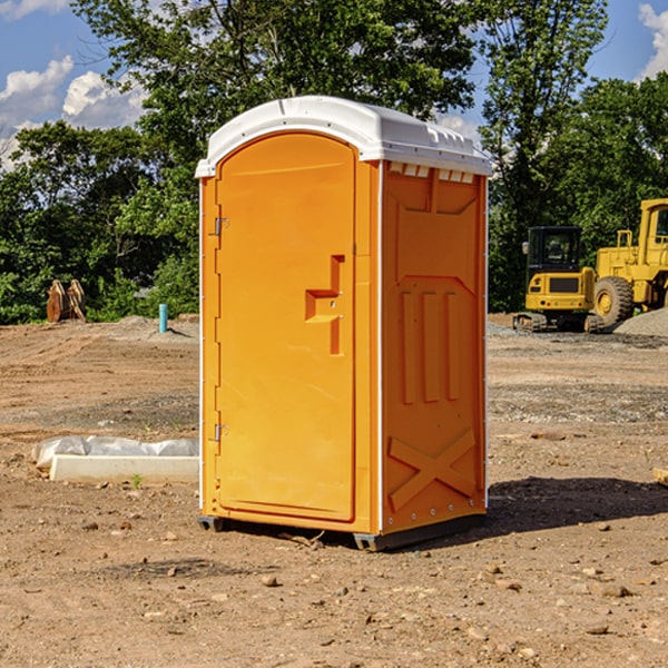 what is the cost difference between standard and deluxe portable restroom rentals in Utica